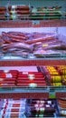 Sausage, salami, lunch meat products on supermarket shelves. Retail industry and chains. Grocery store. Shopping. Rack. Fresh food