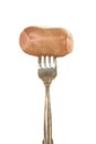 Sausage on a silver fork isolated Royalty Free Stock Photo