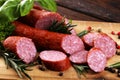 Sausage slices, smoked meat product tasty snack salami menu concept. food background with cracow sausages Royalty Free Stock Photo