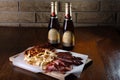 Sausage snacks on a wooden background for beer