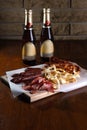 Sausage snacks on a wooden background for beer