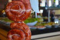 Sausage on the spit being served in a restaurant Royalty Free Stock Photo
