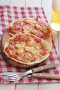 Sausage and tomatoes tortilla pizzas with beer Royalty Free Stock Photo