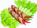 Sausage with vegetables in the plate Royalty Free Stock Photo