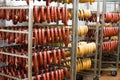 Sausage workshop.stick of sausage are smoked on the background of the meat factory Royalty Free Stock Photo