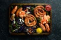 Sausages, baked cabbage, sauerkraut, spices and vegetables. Food.