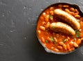 Sausages with baked white beans in tomato sauce Royalty Free Stock Photo