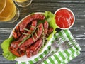 Sausages bratwurst grilled beer homemade on a wooden table Royalty Free Stock Photo