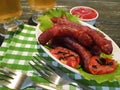 Sausages bratwurst grilled beer delicious on a wooden table Royalty Free Stock Photo