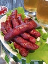 Sausages bratwurst grilled beer delicious on a wooden background table Royalty Free Stock Photo