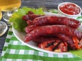 Sausages grilled beer salad cooking on a wooden background table Royalty Free Stock Photo