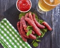 Sausages grilled beer salad recipe nutrition on a wooden background lettuce table Royalty Free Stock Photo