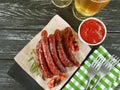 Sausages bratwurst grilled beer eat on a wooden table Royalty Free Stock Photo