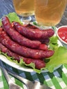 Sausages bratwurst grilled beer rustic delicious on a wooden table Royalty Free Stock Photo