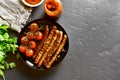 Fried sausage and cherry tomatoes Royalty Free Stock Photo