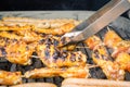 Sausages and chicken wings on smoking grill barbeque Royalty Free Stock Photo