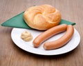 Vienna sausage, roll and mustard on a plate Royalty Free Stock Photo