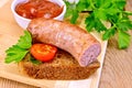 Sausages fried on bread with tomato Royalty Free Stock Photo