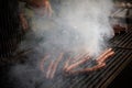 Sausages are fried on fire, bbq grill service. Royalty Free Stock Photo