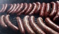 Sausages on a grill. Bratwurst on a barbecue. BBQ. Grilled sausages on bbq. Roasted meat sausages on a barbeque. Fast food outdoor Royalty Free Stock Photo
