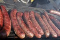 Sausages on a grill. Bratwurst on a barbecue. BBQ. Grilled sausages on bbq. Roasted meat sausages on a barbeque. Fast food outdoor Royalty Free Stock Photo