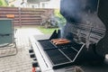 Sausages on the grill. Garden barbecue party. Pork sausages on the grill grate. Grilled bratwurst sausages. Royalty Free Stock Photo