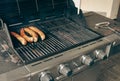 Sausages on the grill. Garden barbecue party. Pork sausages on the grill grate. Grilled bratwurst sausages. Royalty Free Stock Photo