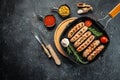 sausages grill on the grill pan. traditional drink and food in pub. banner, menu, recipe place for text, top view Royalty Free Stock Photo