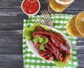 Sausages grilled beer salad recipe nutrition kitchen on a wooden background lettuce table Royalty Free Stock Photo