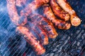 Sausages grilled on a charcoal barbeque. Top view of tasty barbecue, food concept, food on grill and detail of sausages on the