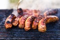 Sausages grilled on a charcoal barbeque. Top view of tasty barbecue, food concept, food on grill and detail of sausages on the