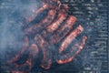 Sausages grilled on a charcoal barbeque. Top view of tasty barbecue, food concept, food on grill and detail of sausages on the