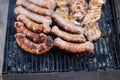 Sausages grilled on a charcoal barbeque. Top view of tasty barbecue, food concept, food on grill and detail of sausages on the