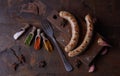 Sausages grilled food background, wood background. Royalty Free Stock Photo