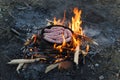 Sausages grilling over the hot glowing coals Royalty Free Stock Photo