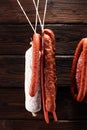 sausages hang from a rack at market. Country dark style. Traditional food. Smoked sausages meat hanging Royalty Free Stock Photo