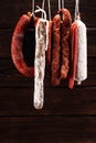 sausages hang from a rack at market. Country dark style. Traditional food. Smoked sausages meat hanging Royalty Free Stock Photo