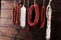 sausages hang from a rack at market. Country dark style. Traditional food. Smoked sausages meat hanging Royalty Free Stock Photo