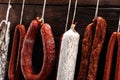 sausages hang from a rack at market. Country dark style. Traditional food. Smoked sausages meat hanging Royalty Free Stock Photo