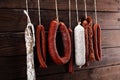 Sausages hang from a rack at market. Country dark style. Traditi Royalty Free Stock Photo