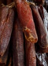 Sausages hang from a rack at market. Traditional food. Smoked sausages meat hanging Royalty Free Stock Photo