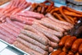 Sausages made of pork and chicken minced meat ready for grilling in meat department of store