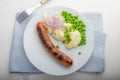 Sausages with mash and some peas Royalty Free Stock Photo