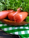 Sausages, parsley organic dinner wooden background pork cooked