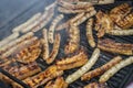 Sausages and pork belly on a smoking grill