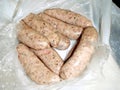 Sausages raw in bag as bought.