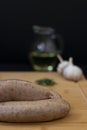 Sausages ready for cooking with raw ingredients