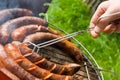 Sausages roasting: grilling Royalty Free Stock Photo