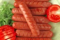Sausages served with tomato Royalty Free Stock Photo