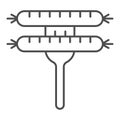 Sausages thin line icon. Two Sausages on a fork illustration isolated on white. Two fried sausages outline style design